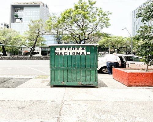 A clean physical mailbox and entrance of an urban community office building in Mexico City
