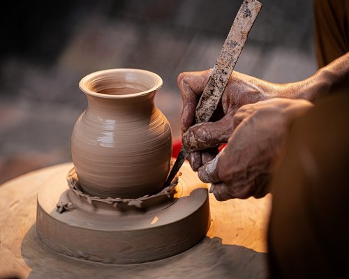 Urban context showcasing traditional Mexican pottery elements under soft diffused veranda shadows